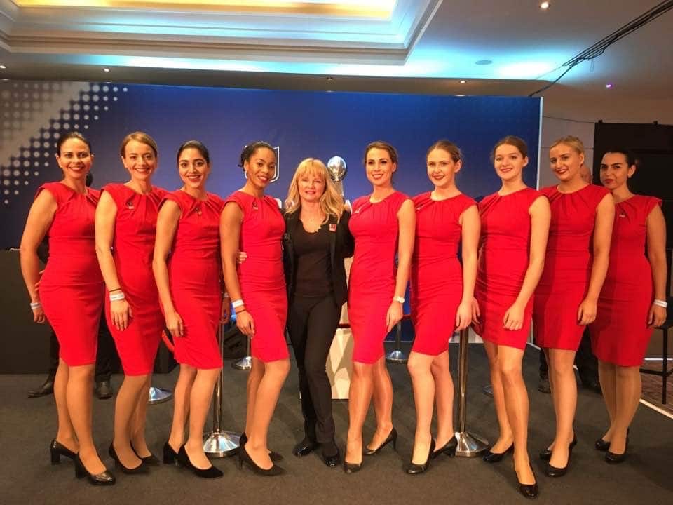 Aesthetics Event Staff wearing red dresses