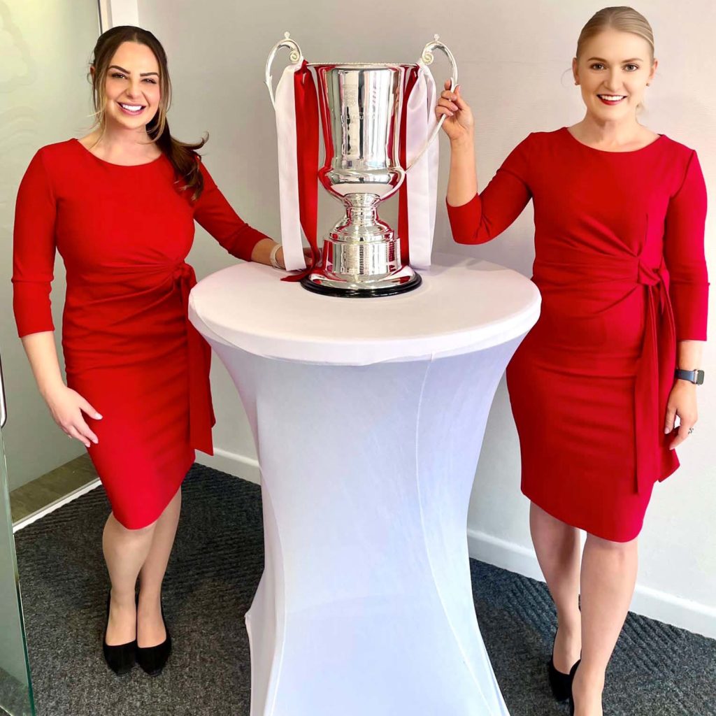 nottingham forest event staff holding trophy